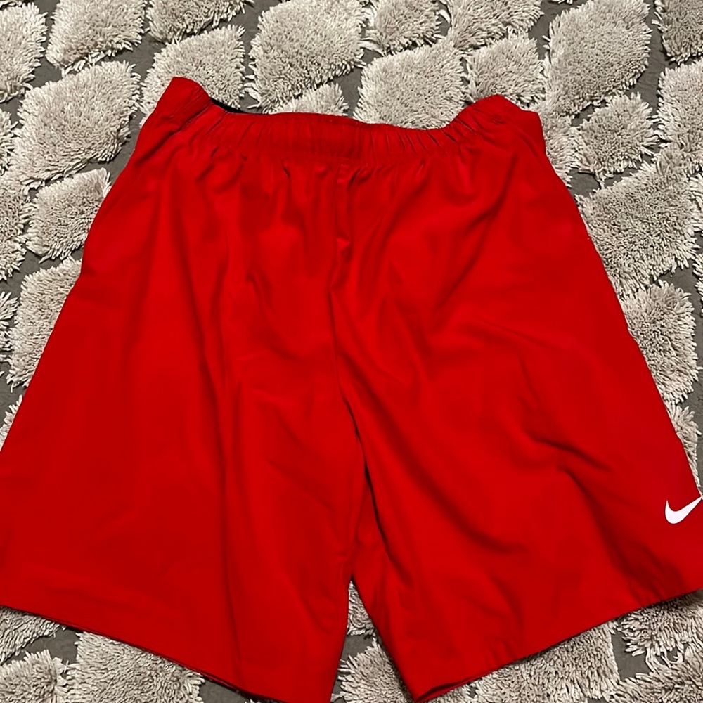 Red Nike nylon shorts